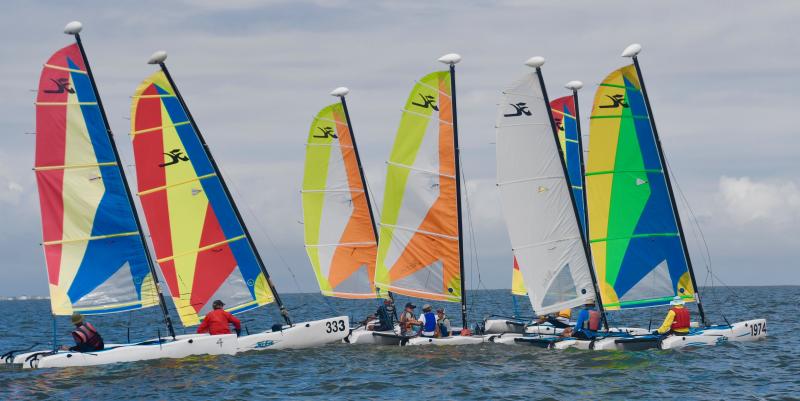 Hobie Cats in the Wave fleet start the first race of the Summer Winds Regatta in Delaware Bay off Lewes Beach.