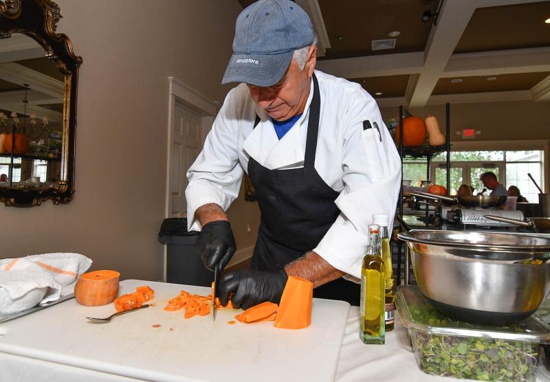 Franco Brattoli from Two Meatballs chops some summer squash.