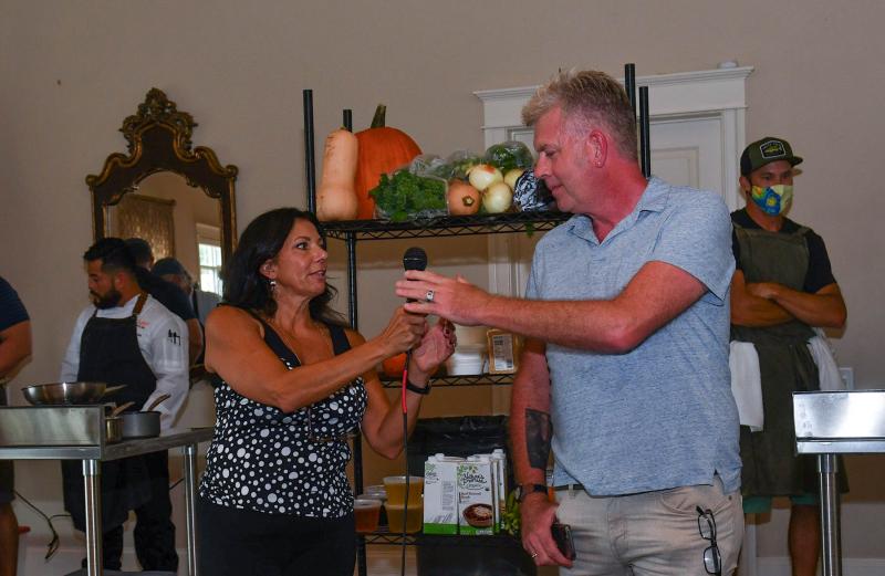 Founder and organizer of the Southern Delaware Wine, Food & Music Festival Stacy LaMotta, left, shares the mic with Chef Throwdown host Michael Sprouse.