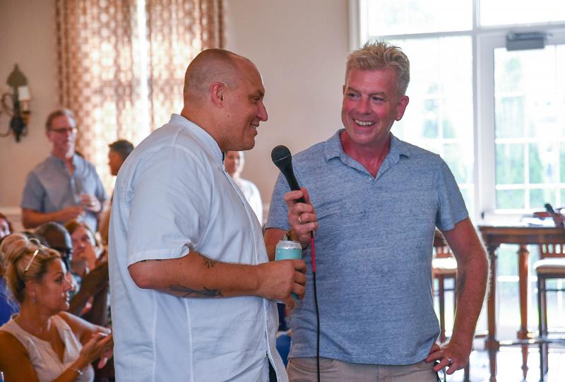 Chef Throwdown host Michael Sprouse speaks with event judge Matt Kern.