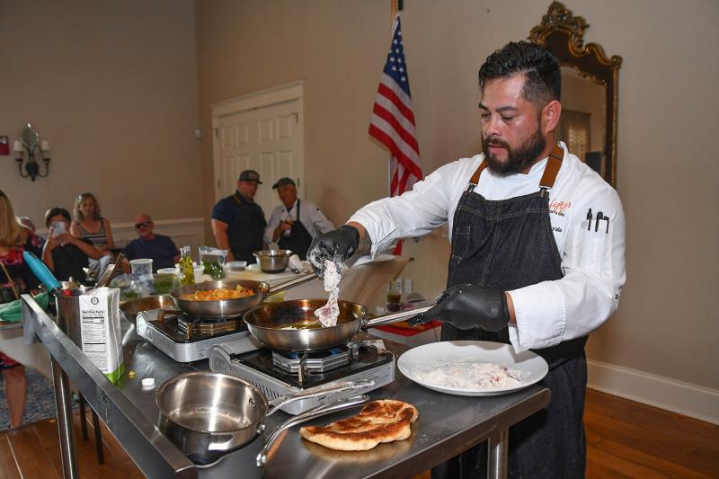 Osvaldo Ayala of Lefty’s Alley & Eats takes his turn during the Chef Throwdown.