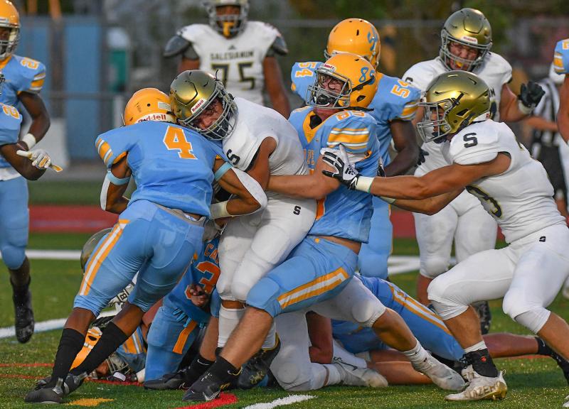 Cape defensive players Keishawn Mansfield and Nathan Horn put a stop on Sallies player Cooper Brown.