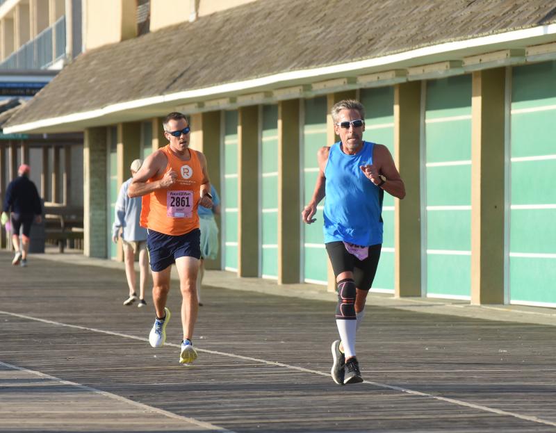 John McCann of Lincoln University, Pa., left, and Jeff Smith of Wilmington, N.C. stay neck and neck; both finished with a time of 1:09:14 in the 10-miler.