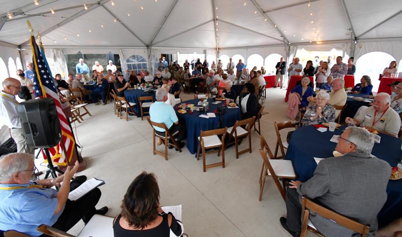 A large crowd gathers at the Fort Miles Museum for the opening ceremony of the Oil Still Bleeds USS Arizona exhibit.