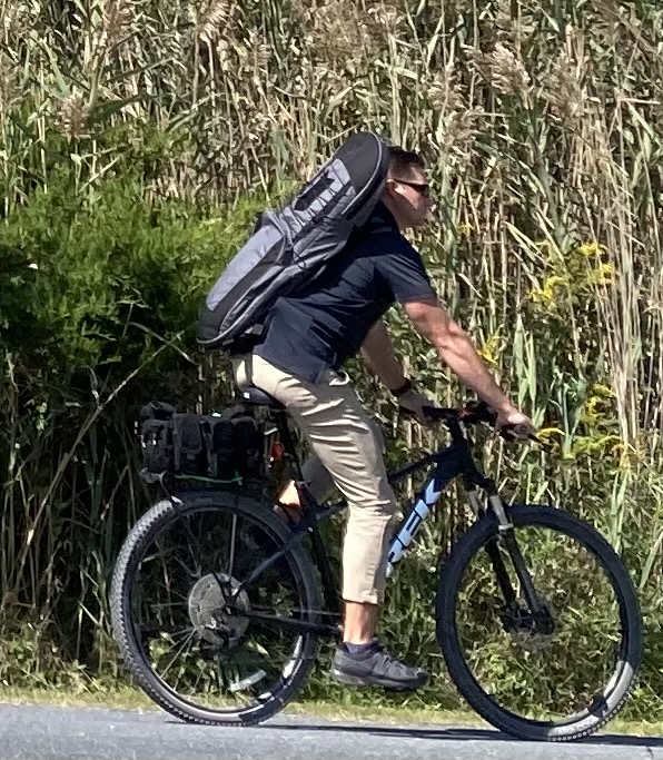 Nothing to see here ... just a man going for a bike ride who looks like a professional athlete and has an unusual backpack. ASHA MOON PHOTO