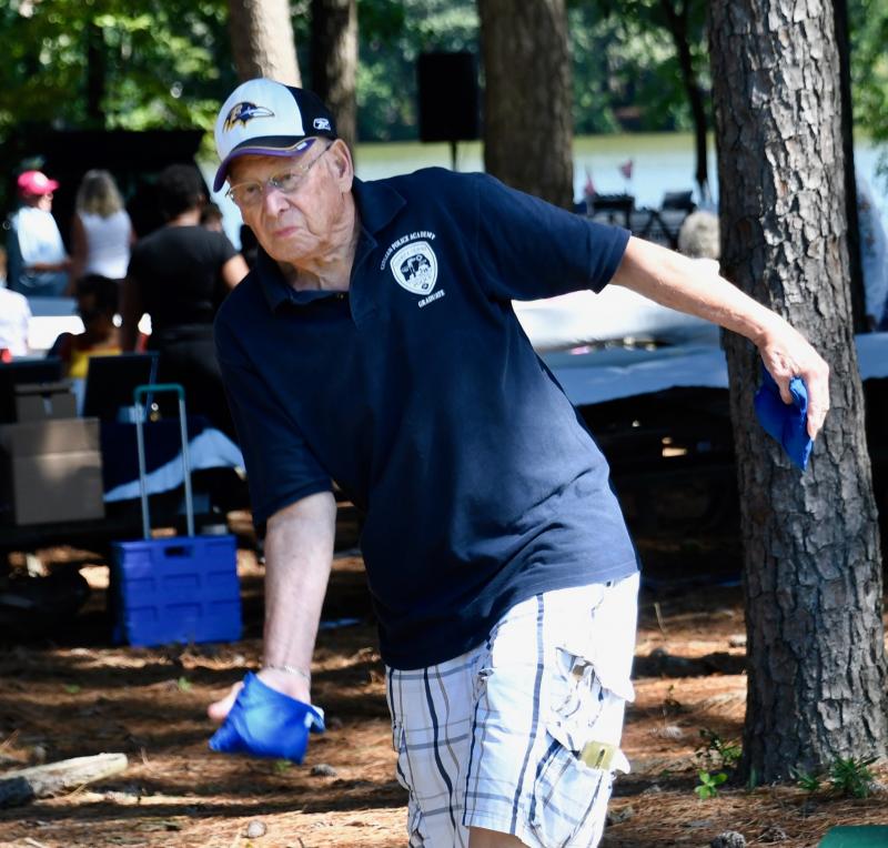 Edie Hiner of Ocean View throws a bean bag during a competitive game of cornhole at the CHEER picnic. Hiner turned out to be the one to beat.