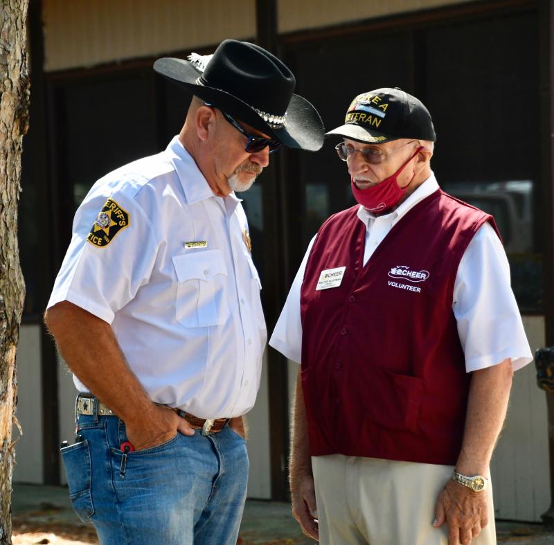 CHEER board president and active volunteer Walt Koopman visits with Sussex County Sheriff Bob Lee.