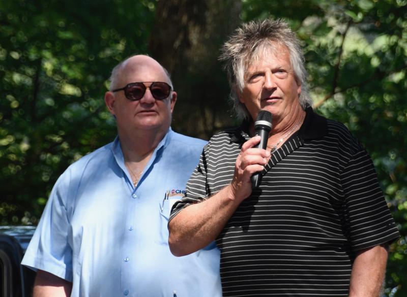 CHEER CEO Ken Bock, left, is introduced by DJ Sky Brady as he prepares to offer the blessing before lunch is served.