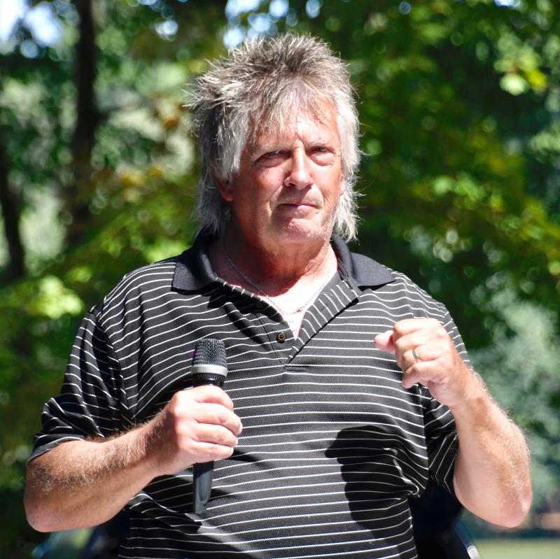 DJ Sky Brady does the Chicken Dance as he keeps the party hopping throughout the four hours of the picnic.