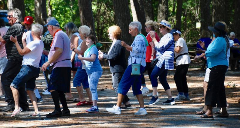 Dancing is always an important part of every CHEER picnic, including doing the steps of the Electric Slide.
