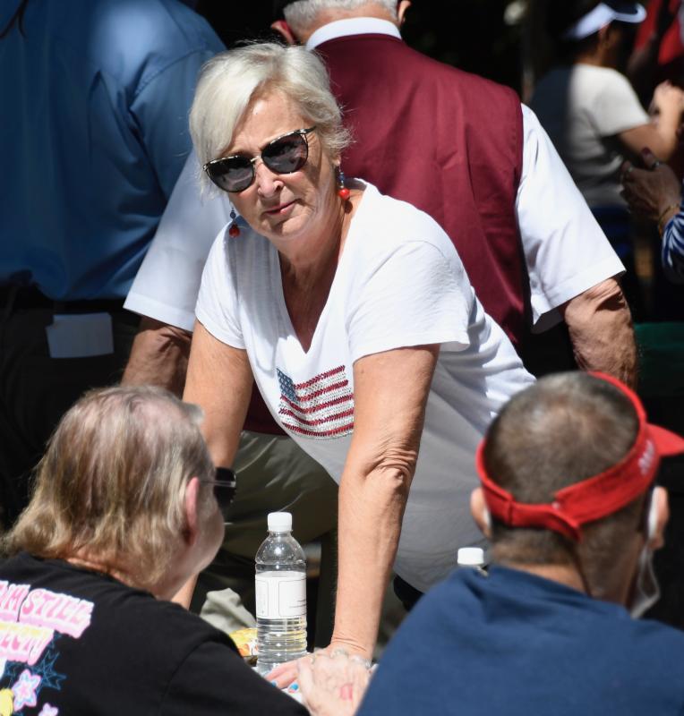Rep. Ruth Briggs King, R-Georgetown, stops by to chat with seniors attending the picnic at Trap Pond State Park.