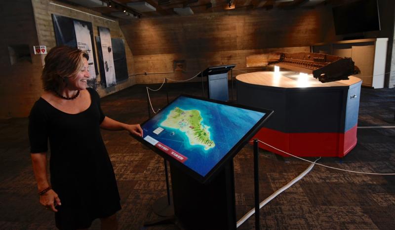 Heidi Nasstrom Evans, exhibit curator and senior associate with Horizon Philanthropic Services, demonstrates how the exhibit’s interactive map will provide information on Delawareans who were at Pearl Harbor on Dec. 7, 1941.