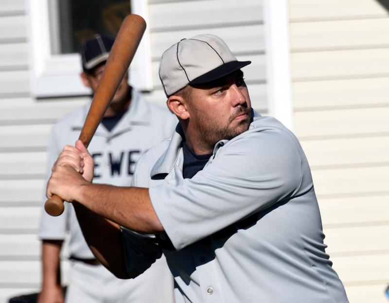 Lead-off batter Mike “Chicken” Curry waits for a pitch to hit. He reached base and scored the first run for Lewes.