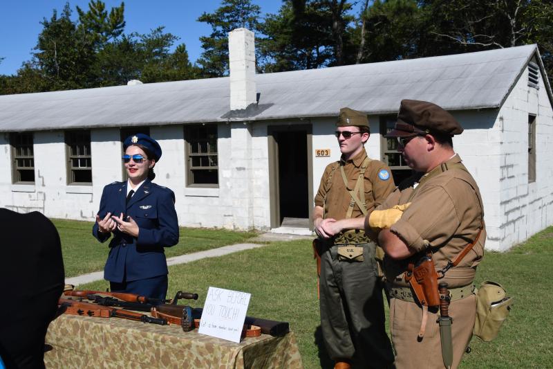 Members of the Air Mobility Command Museum living history team portray the World War II roles of a woman pilot, a test pilot and a member of a rocket test squadron. They are (l-r) Emily Malone, Nick Saborio and Patrick O’Neill.
