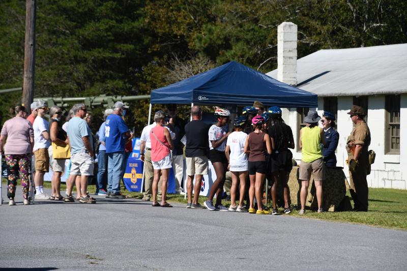 A crowd gathers to learn about the history of Fort Miles, which played a pivotal role in coast defenses during World War II.