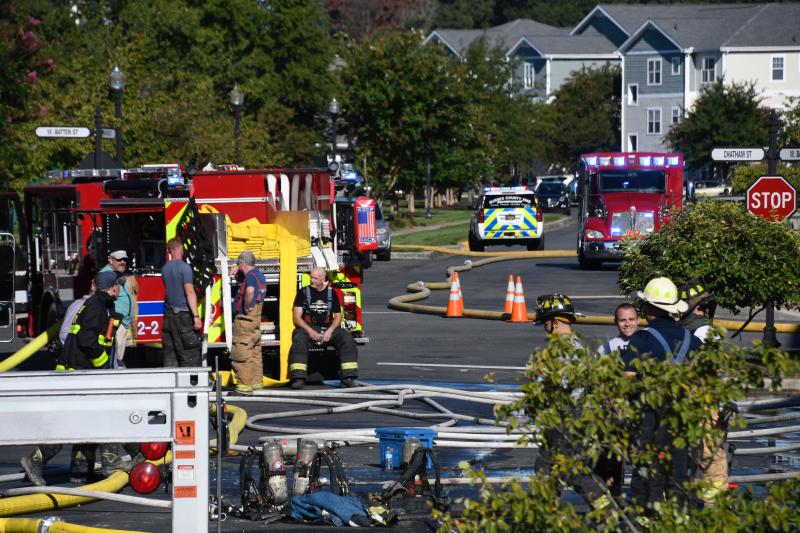 Several streets in the Villages of Five Points are closed to traffic early Sunday morning as volunteer firefighters stage their trucks.