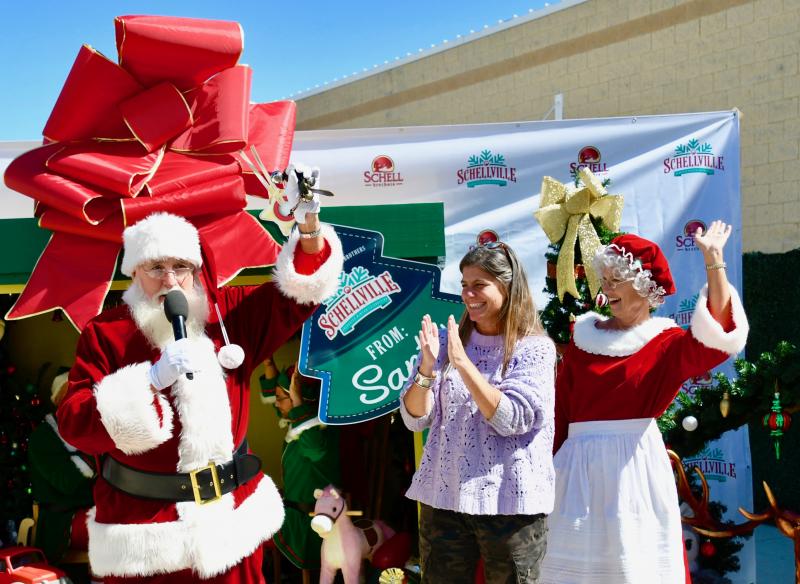 Santa and Mrs. Claus join Alyssa Titus, Schell Brothers director of marketing, to officially announce the Enchanted Winter Celebration during a Sept. 30 press conference at Tanger Outlets Seaside.