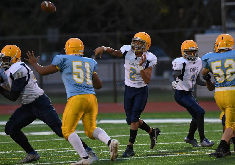 Beacon quarterback Jameson Tingle throws to the flat while teammate Daveyonn Conquest blocks backside.