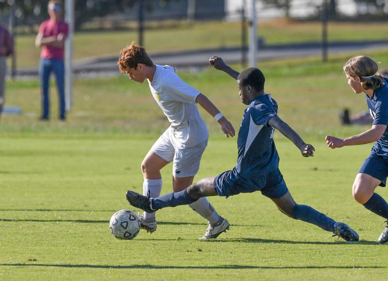 Lake’s Coen Dempsey, right, goes for the trap on Cape’s Brandon Somoza-Lima.
