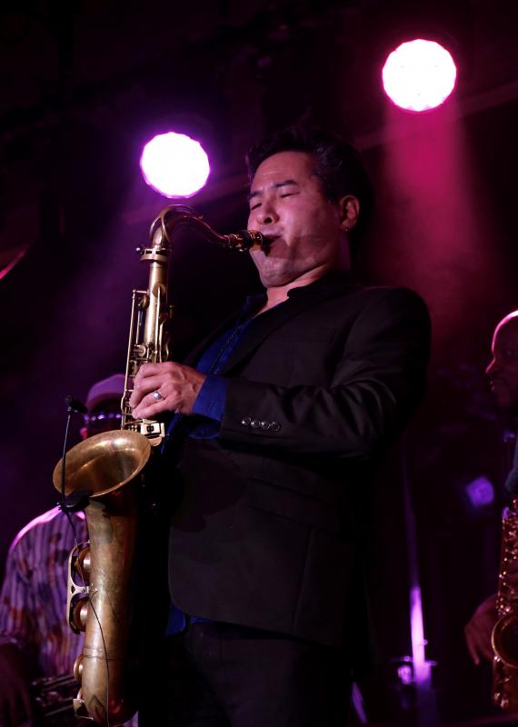Jeff Kashiwa, a member of the Unscripted All-Stars, plays the saxophone during an Oct. 16 concert at the Rehoboth convention center. Kashiwa, from the Seattle, Wash. area, also appears with the band The Rippingtons and is a college professor.