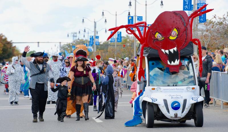 The festival’s newest character, Lobster Monster, sits atop the Rehoboth Beach-Dewey Beach Chamber of Commerce electric vehicle.