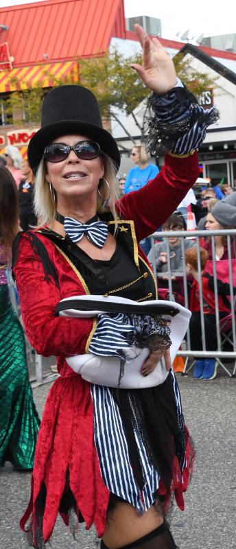 Rachel Webster, co-owner of Rehoboth Toy and Kite Co., waves to the large parade crowd. The company is the Rehoboth Beach Business of the Year.