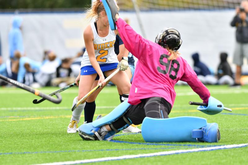 CR goalie Bailey Minear makes a split save early in the game. DAVE FREDERICK PHOTOS