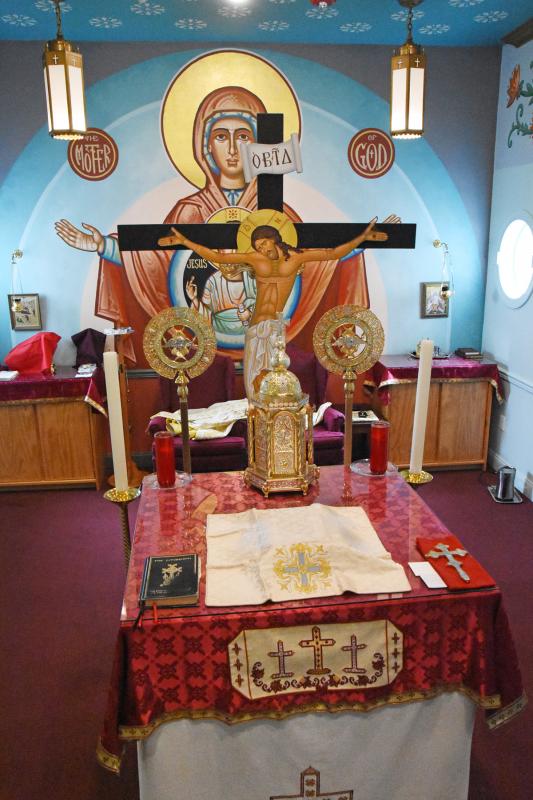 On the east wall in the sanctuary immediately behind the altar is the icon of the Mother of God and Jesus Christ with arms outstretched.