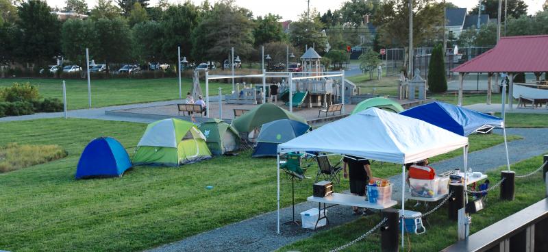It’s not often – if ever – that passersby see tents pitched on the grounds of Canalfront Park in downtown Lewes.