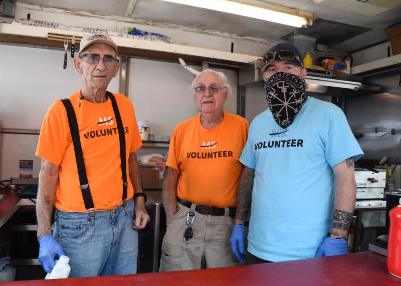 Odd Fellows volunteers (l-r) Richard Scott, Marshall Reynolds and Ben Reynolds provide scrapple and sausage sandwiches and hot dogs to riders at a rest stop at Sussex Consortium near Lewes. The Odd Fellows and Rebekahs have been stocking a rest stop with food and baked goods since the mid-1980s.