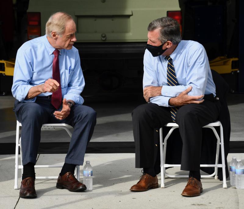 A meeting of the minds? U.S. Sen. Tom Carper, left, and Gov. John Carney converse before the ceremony begins. Carney worked in Carper’s administration when he was governor of Delaware.