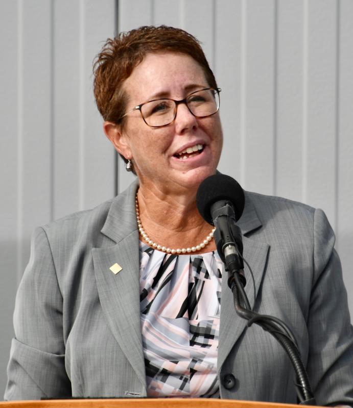 Delaware Technical Community College Vice President and Owens Campus Director Bobbi Barends welcomes guests to the Oct. 13 dedication ceremony.