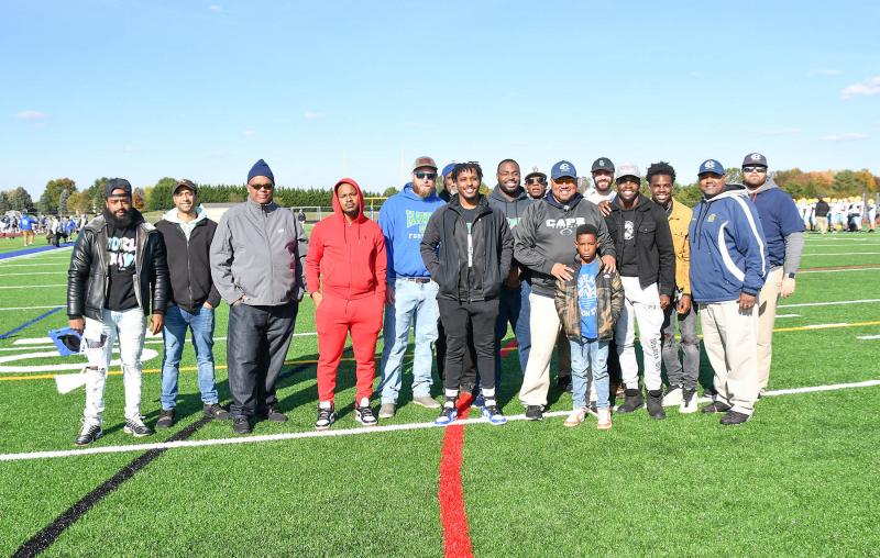 St. Georges alumni who played for Cape coach J.D. Maull pose with him after the game. Shown are (l-r) Vaughn Williams, Zach Bowe, Robert Shorts Sr., Mohammed Barry, Nate Leo, Robert Grundy, Robert Grundy Sr., Chris Henlon, Juluis Maull, Phil Sanclemente, J.D. Maull, Scotter Selby’s nephew Zy Smalls, Duce Selby, Ronnie Burton and Ralph Lopez.