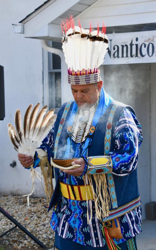 Herman Jackson begins a ceremony to bless the grounds around the Nanticoke Indian Center to start the ceremony.