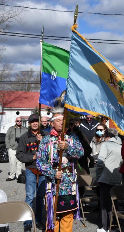 Nanticokes Mike Harmon, front, and Greg Harmon present the Delaware and Nanticoke Tribe flags to start the ceremony.