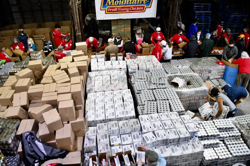 It’s hard to believe, but all of the boxes filled with supplies will become Thanksgiving meal containers.