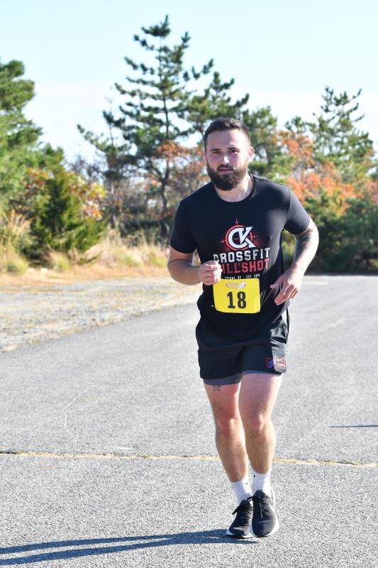 Ryan Budnik heads home with a time of 2:10:15.