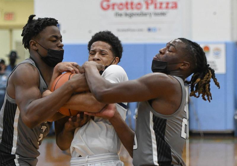 Gray versus West Catholic players battle to a jump ball.