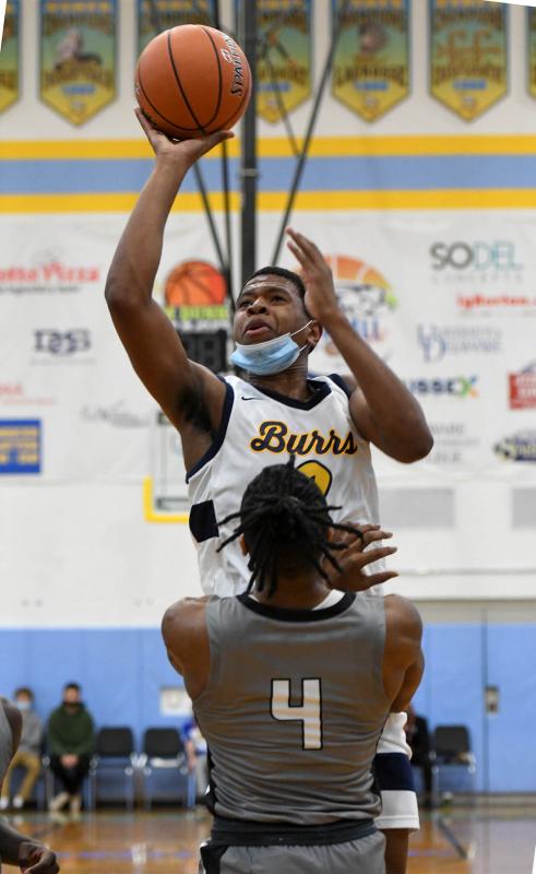 West Catholic’s Zion Stanford hits over Gray’s Calvin Hall.