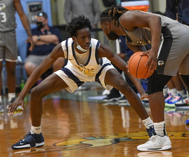 West Catholic’s Isaac Cole plays tough defense.