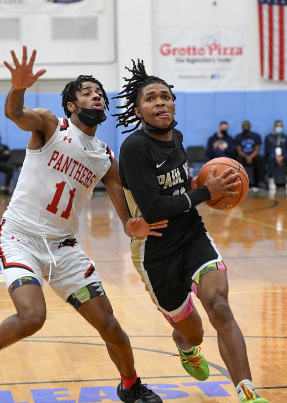 Paul VI guard Dug McDaniel drives to the basket.
