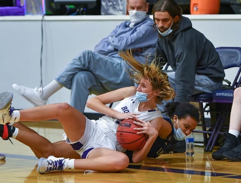 Delmarva Christian’s Ainsley Bell makes a diving grab for possession from Holly Grove’s Natalie Parks in the 64-24 thrashing of the Eagles. DAN COOK PHOTOS