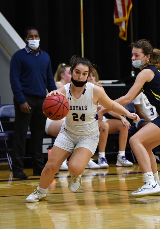 Sophomore Ryley McCluskey drives baseline.