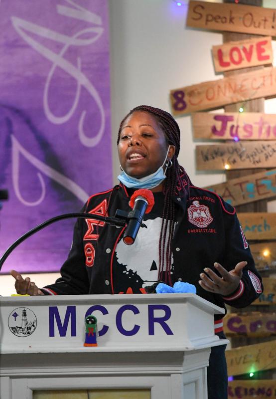 Pastor Tesha Miller of Macedonia AME Church in Seaford speaks to the crowd gathered to observe World AIDS Day.
