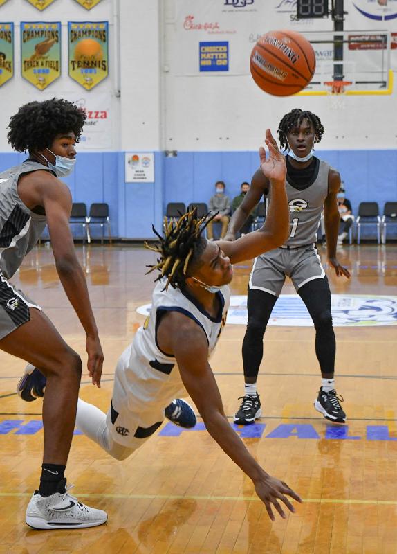 West Catholic’s Shemar Wilbanks-Acqui throws one up after being fouled.