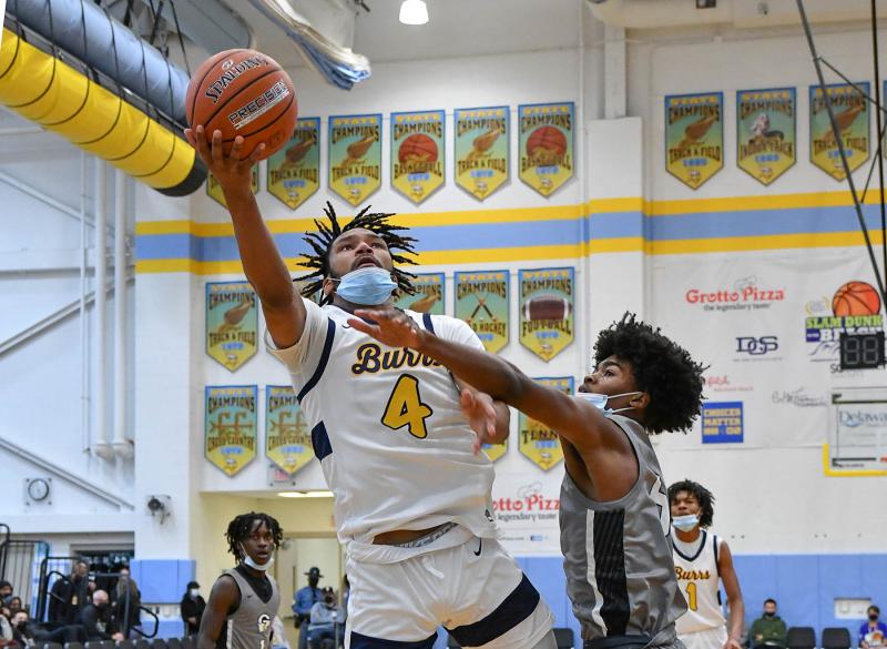 West Catholic’s Marcus Branker puts in a lay-in over Gray’s Avantae Parker.