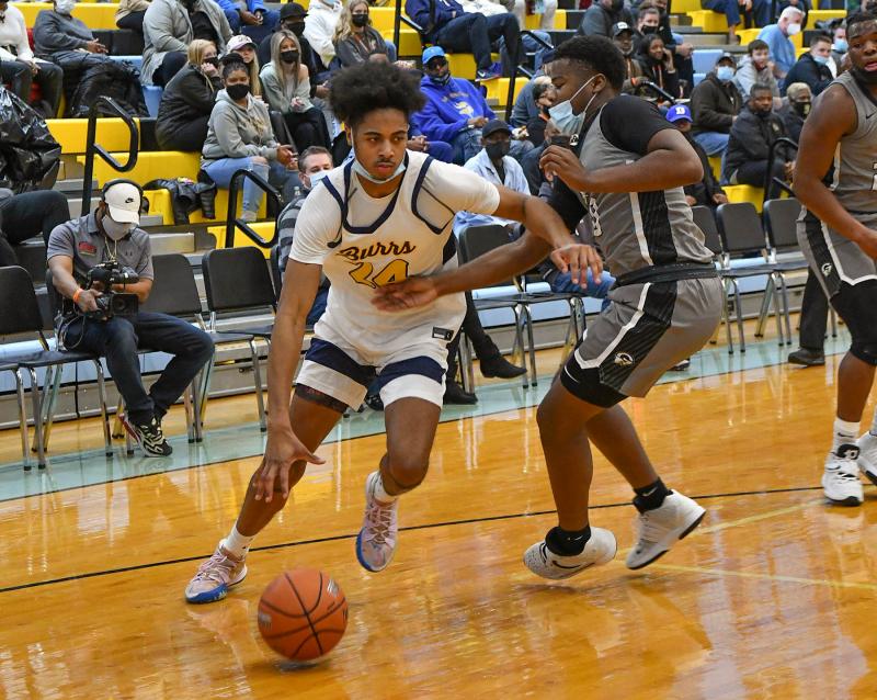 West Catholic’s Nasir Griffin drives baseline on Gray’s L.J. Britt.