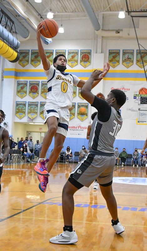 West Catholic’s Adam Clark glides to the hoop over Gray’s L.J. Britt.
