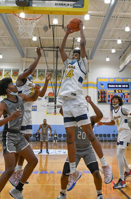 West Catholic’s Nasir Griffin goes in for a slam.