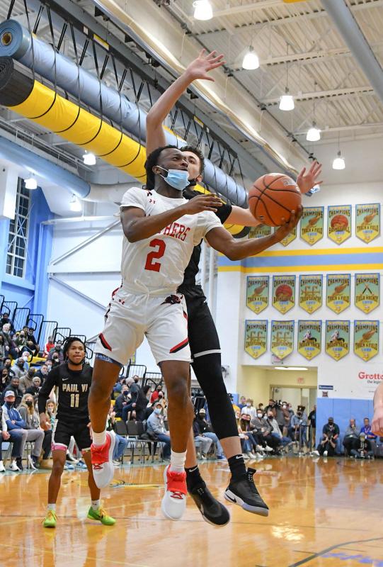 Imhotep’s Ronny Rapheal goes up and under for a deuce.